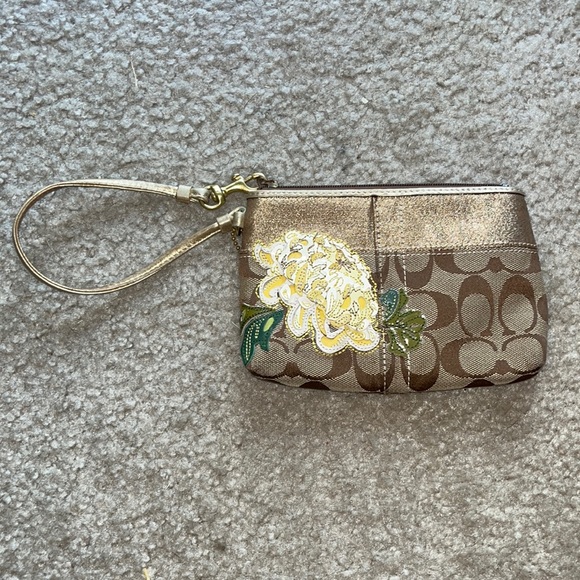 Coach wristlet with gold and flower accent - Picture 2 of 7